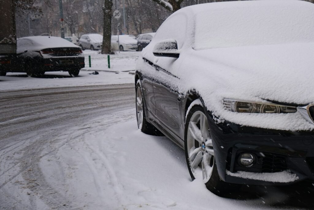 Car covered in snow on a winter street in Mississauga